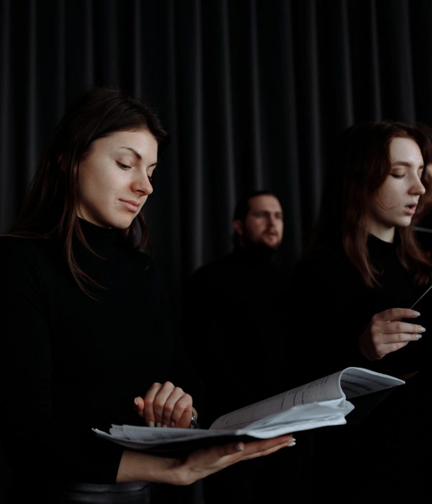 A group of people singing at a church.