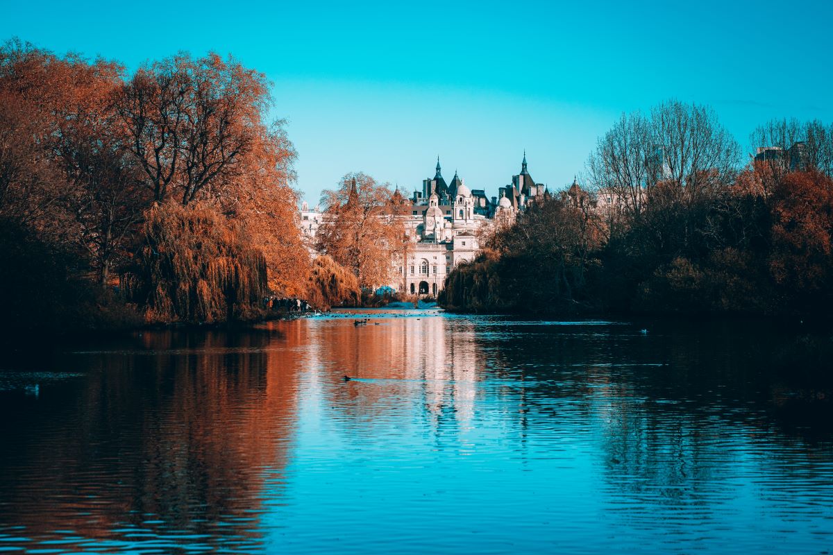 A view of the lake and the surrounding landmarks at St. James Park in London