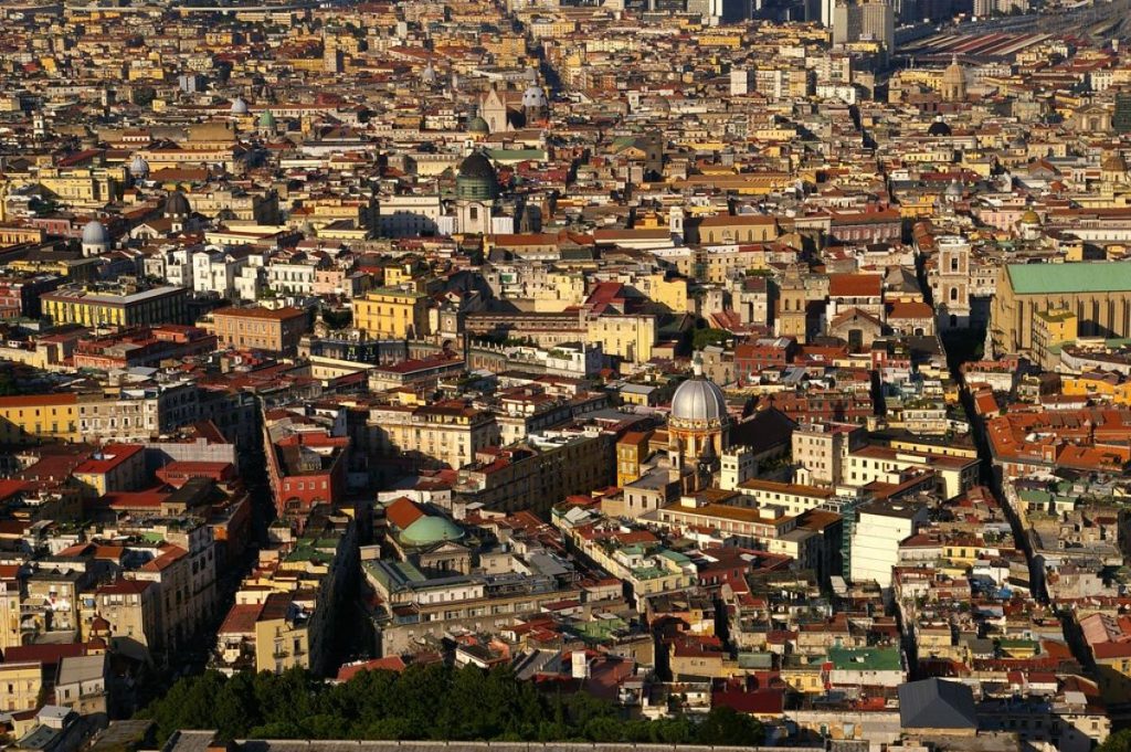 Many buildings along a big street called Spaccanapoli dividing it in Naples, Italy