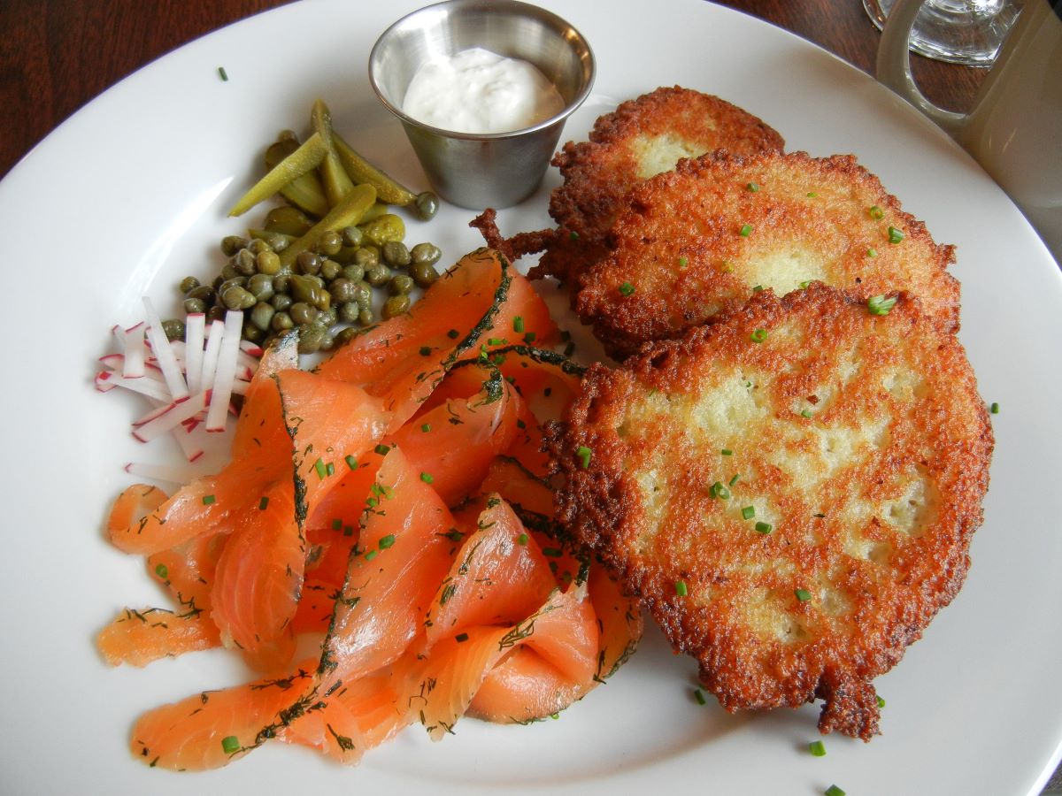 potato pancakes and smoked salmon on a plate