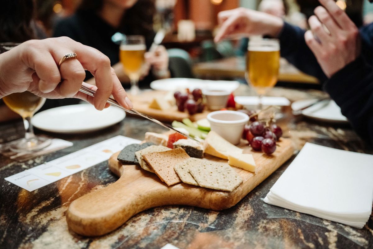 people eating and drinking in a bar