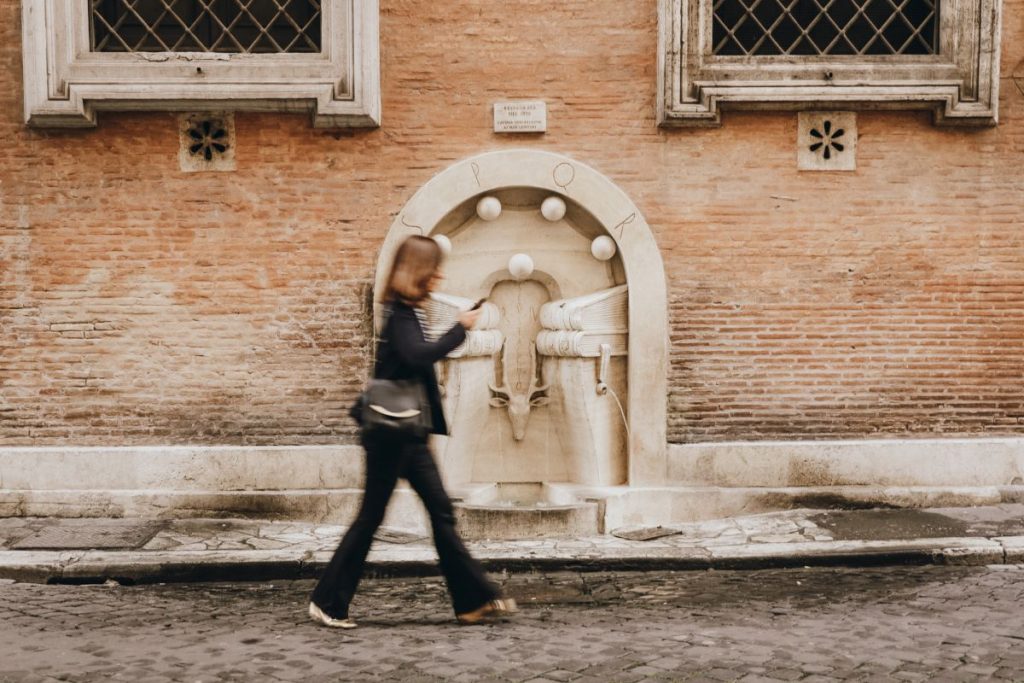 woman walking through the streets of Rome.