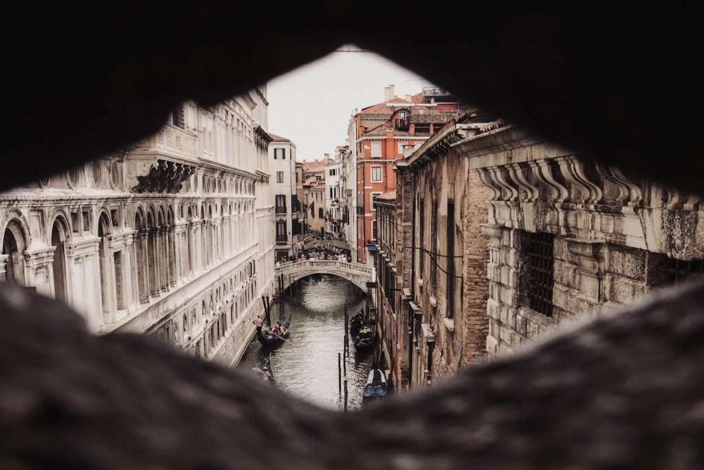 Venice canals and people exploring the city