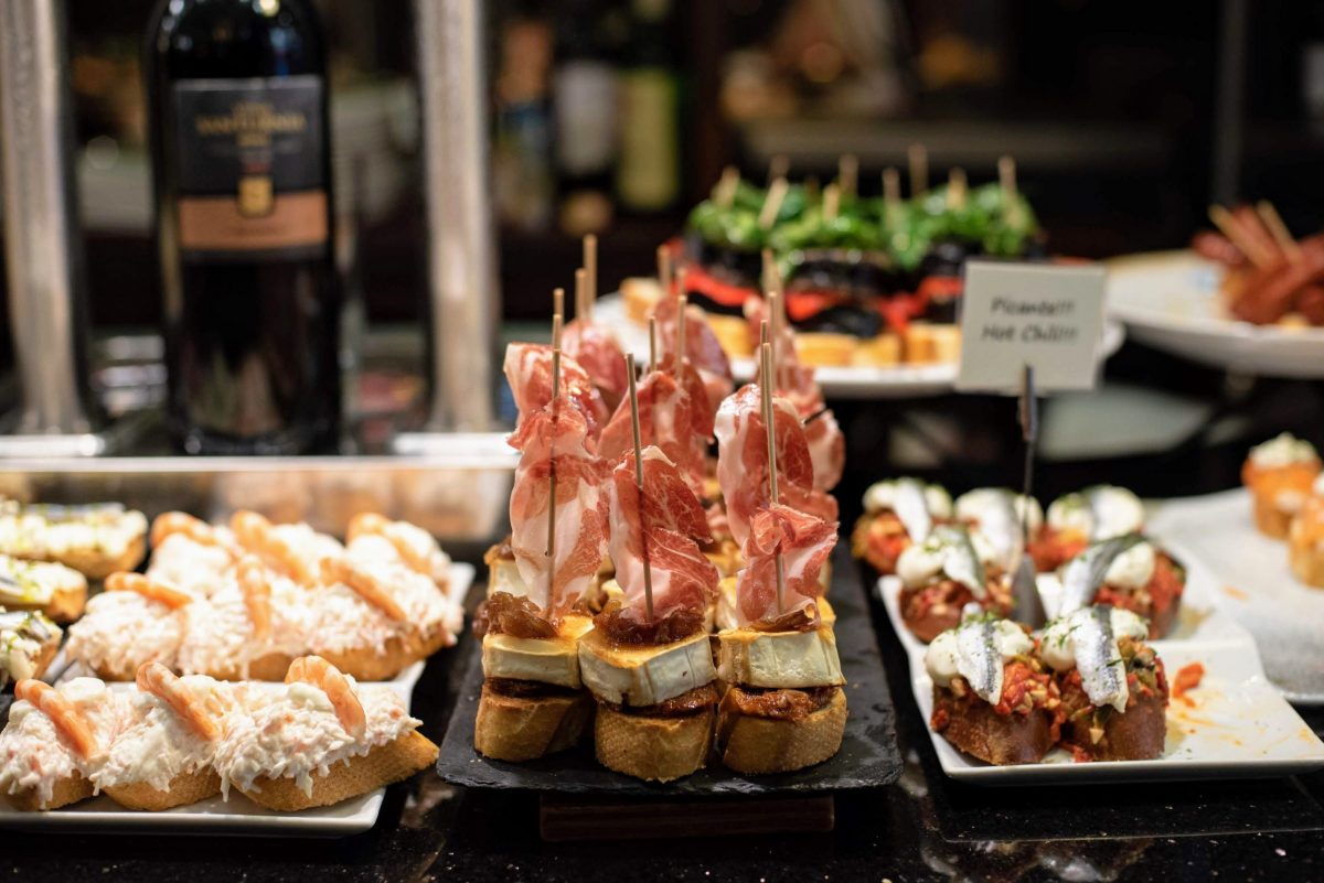 slices of bread with different toppings like seafood, meat and cheese