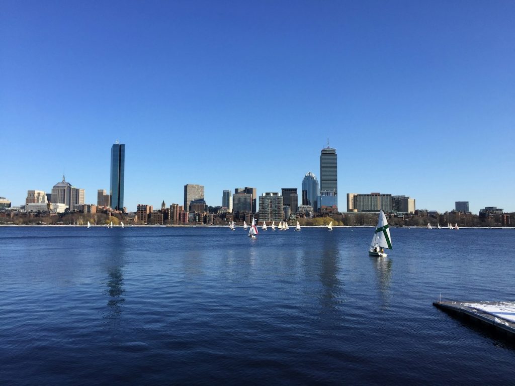 body of water with skyscrapers and small boats