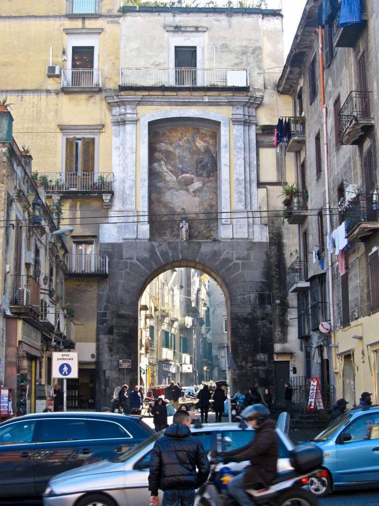 old city street scene with large arched walkway