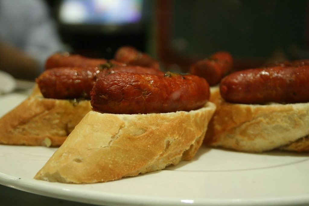 A plate of txistorra sausage pintxos.