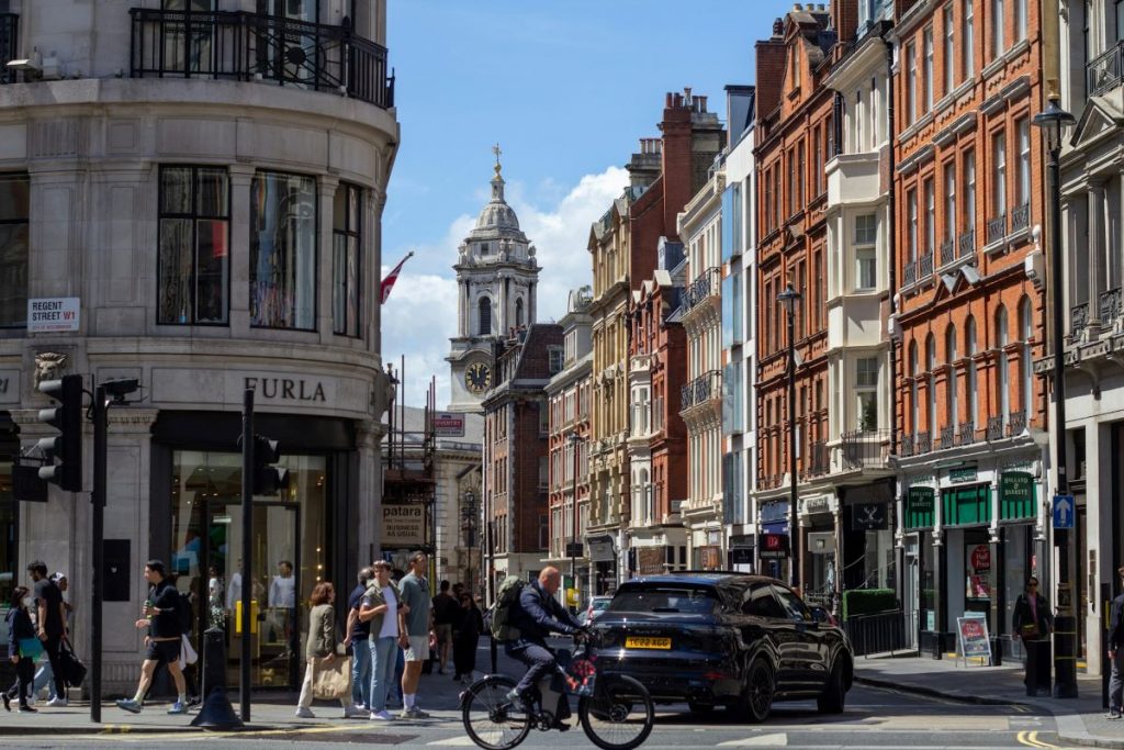 People walking around the busy neighborhood Wayfair in London. 