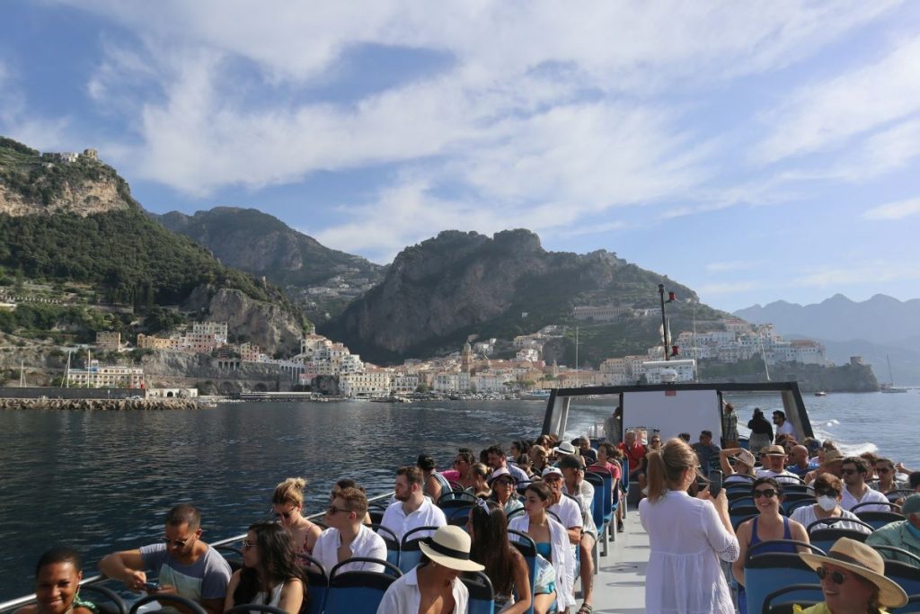 A group of people taking the ferry to Capri.