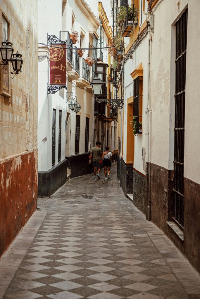 Narrow streets in the Santa Cruz neighborhood in Seville. 