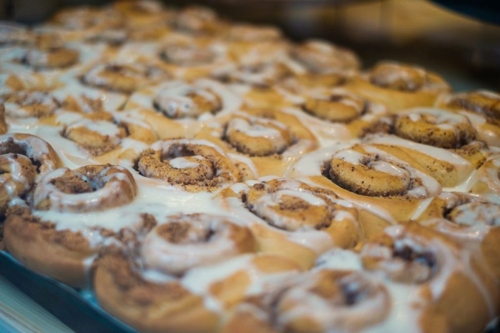 A tray of cinnamon rolls in Barcelona with royal icing on top. 