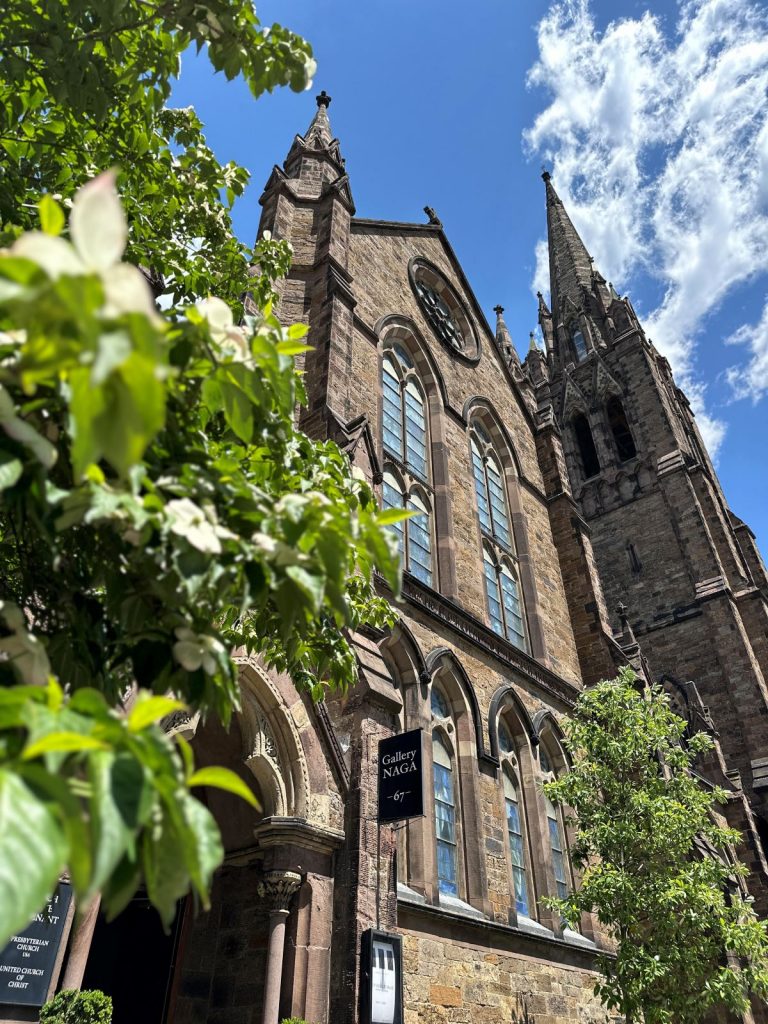 image of large church with greenery out front