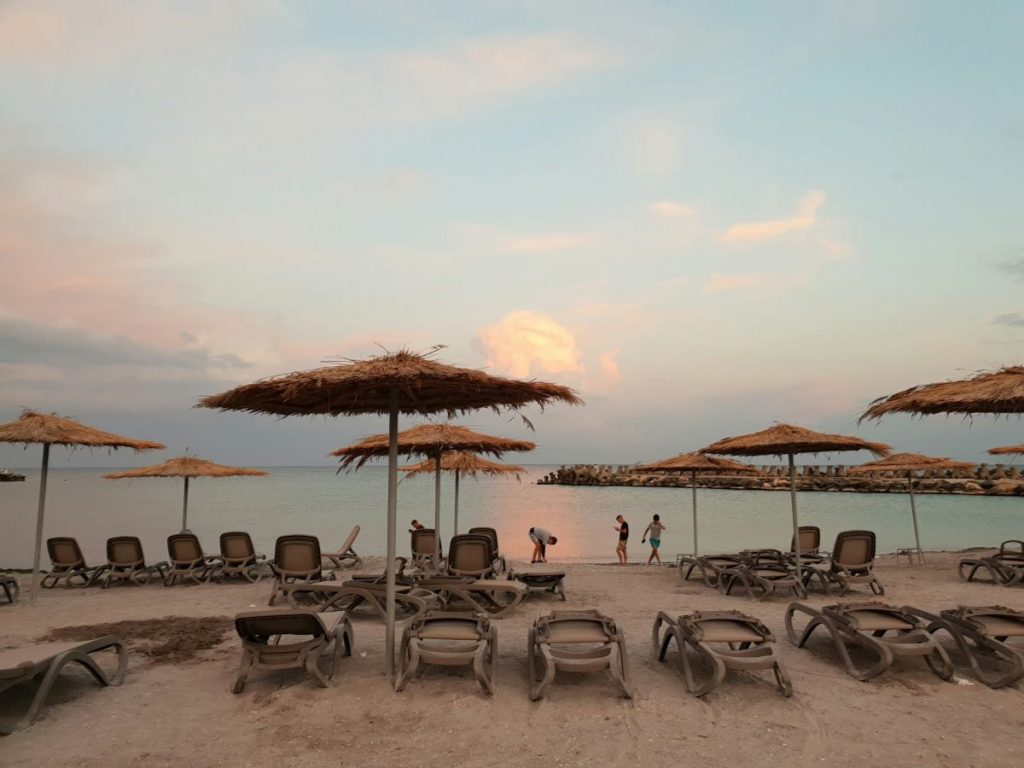 Beach chairs and umbrellas at a beach in Athens. 