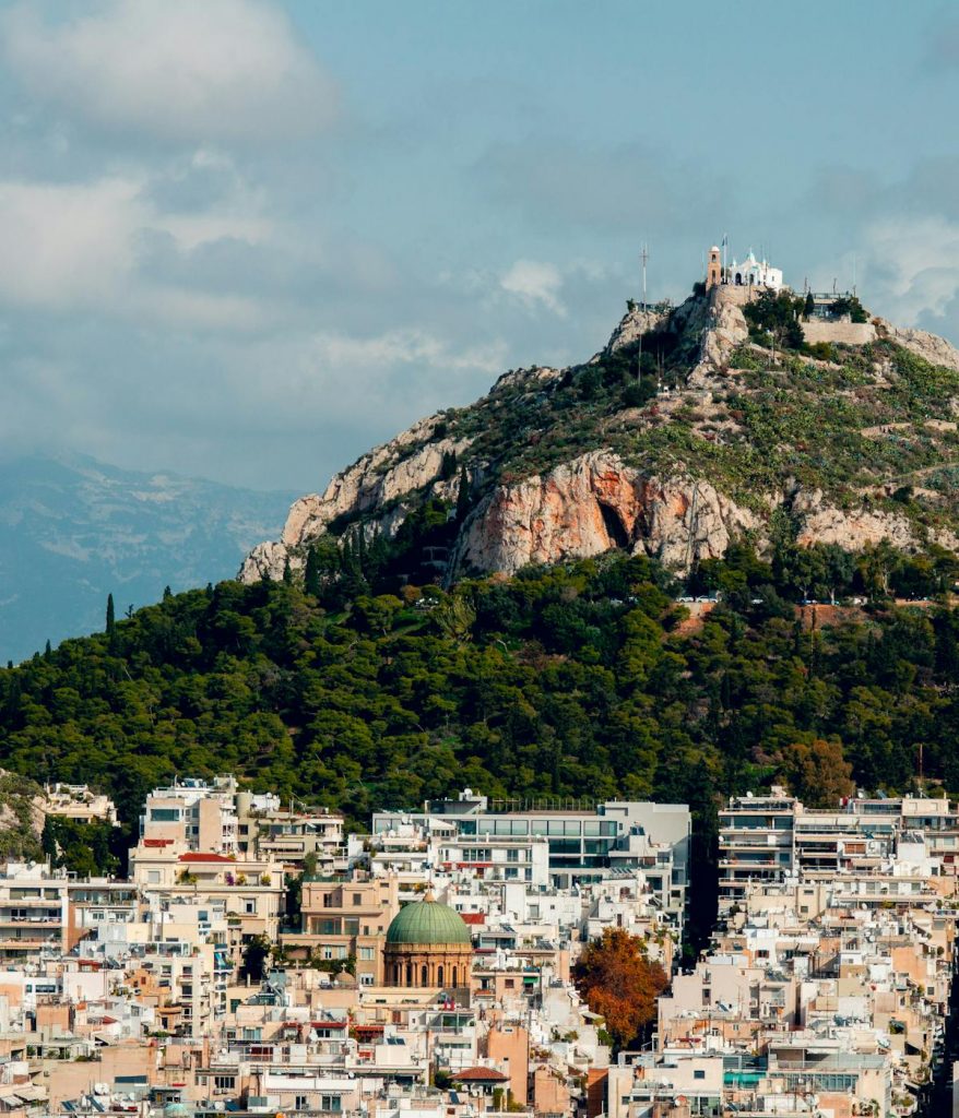 View of Lycabettus Hill from afar in Athens, Greece. 