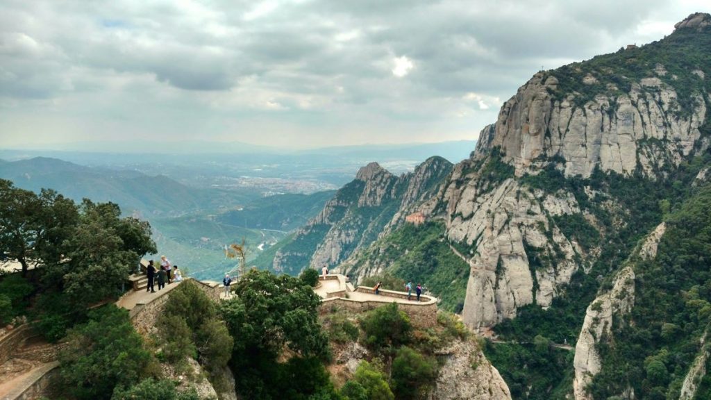 People walking up to a viewpoint at Montserrat, Spain. 