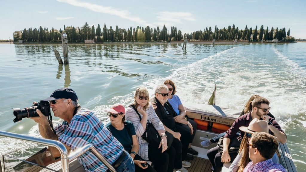 People taking a boat tour of the Venetian Islands.