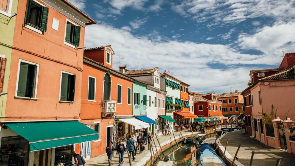 Vibrantly painted houses line the canals in Burano, Venice.