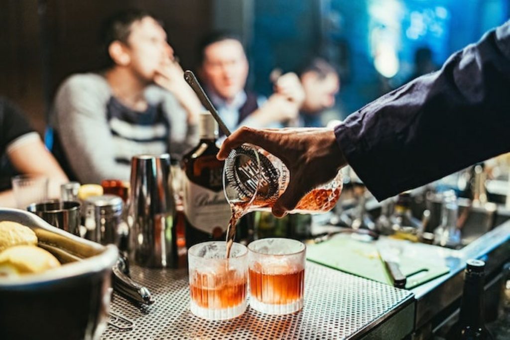 bartender making cocktail drinks