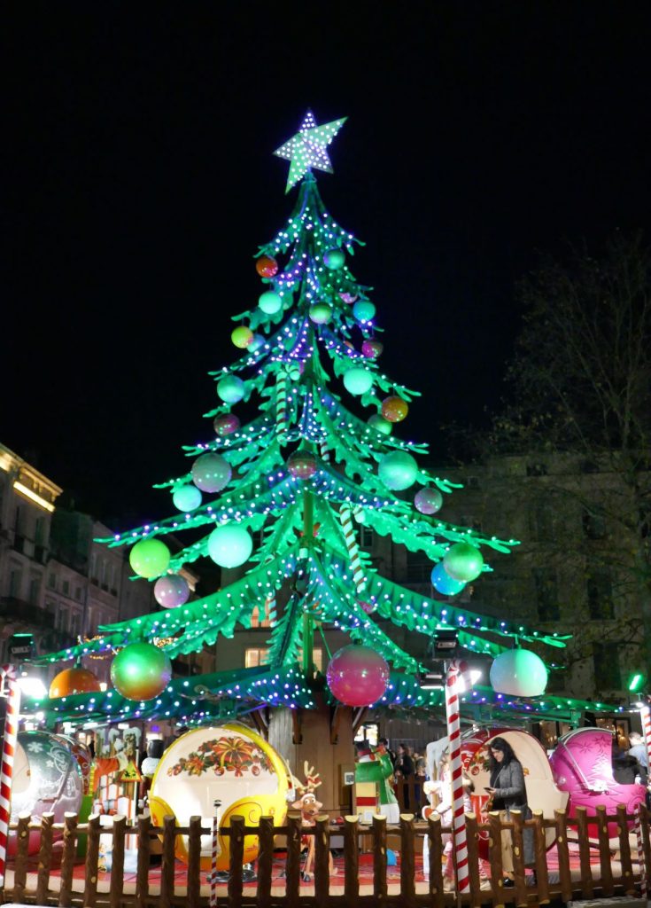 children's ride with festive christmas tree 