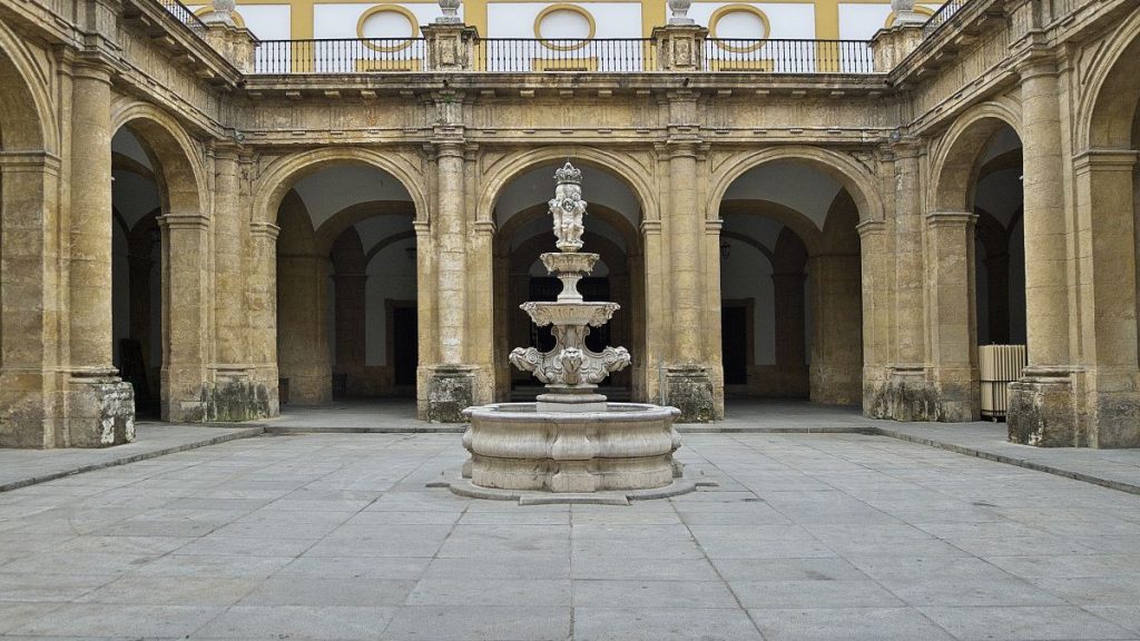 interior patio with a round fountain in the middle