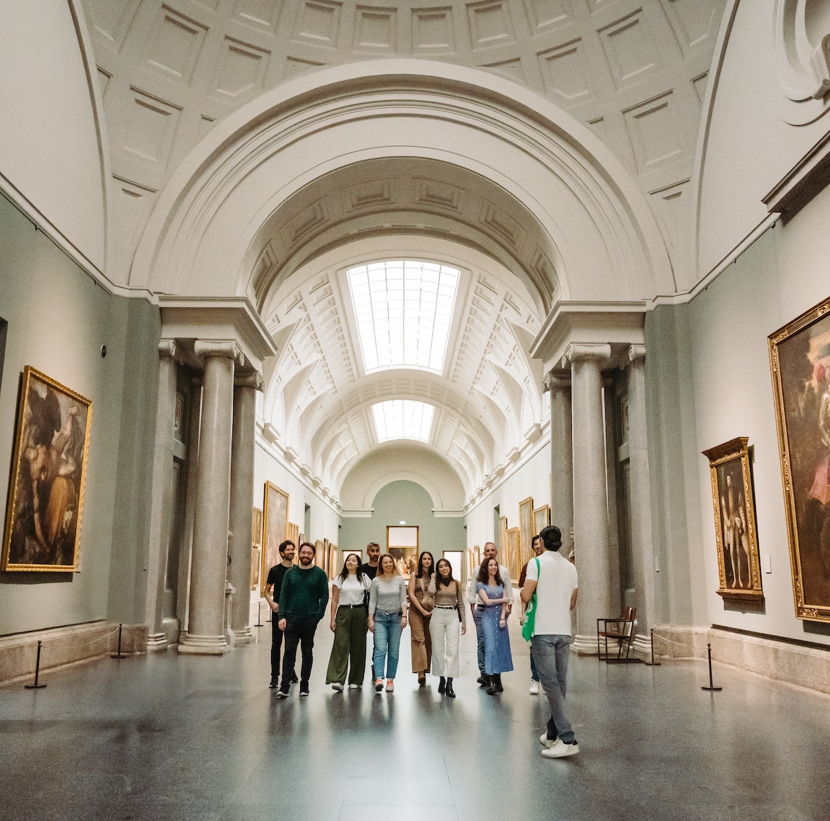 Group walking inside the Prado museum