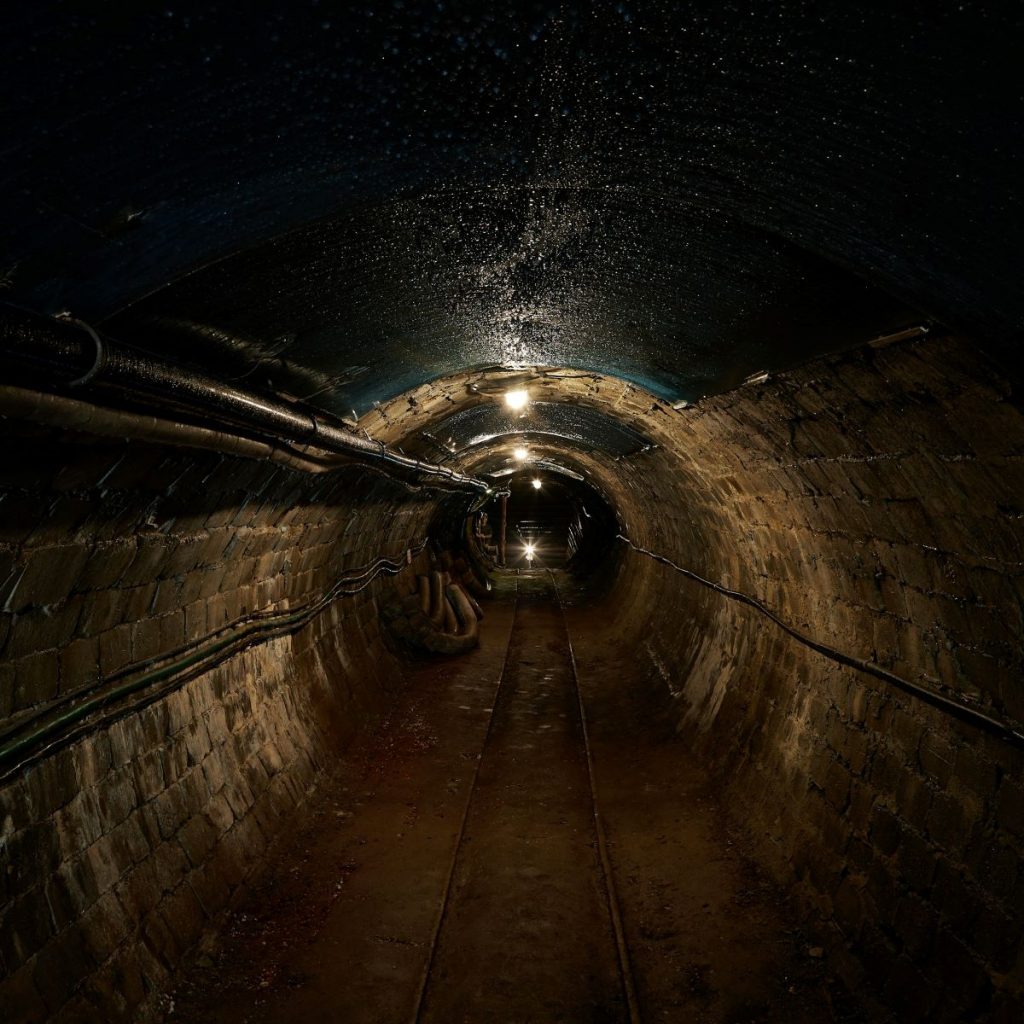 A sewer system under a bustling city. 