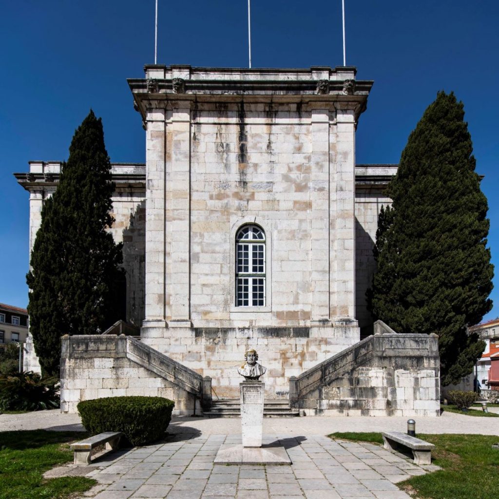 large concrete building with staircases on either side