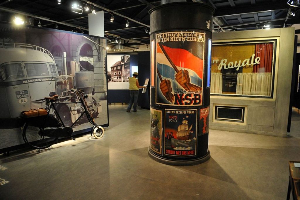 A person looking at an exhibit at the Resistance Museum in Amsterdam. 