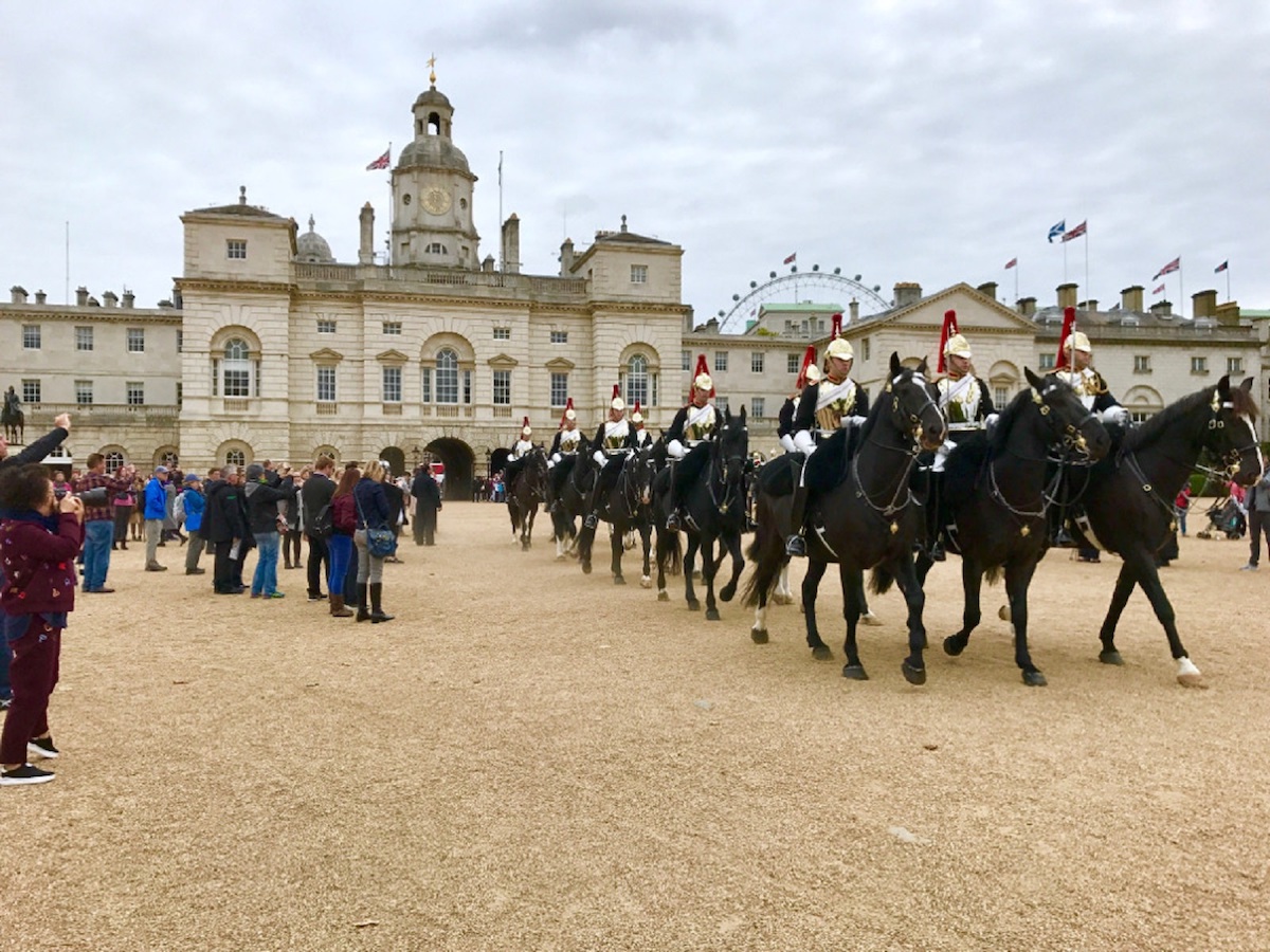 Changing of the Guard ceremony in London with horses and people