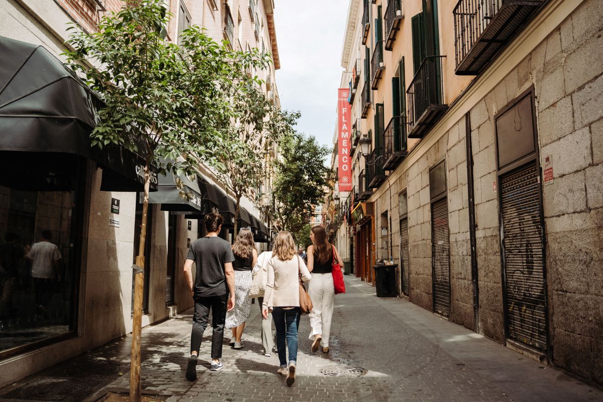 People walking around Las Letras neighborhood in Madrid. 