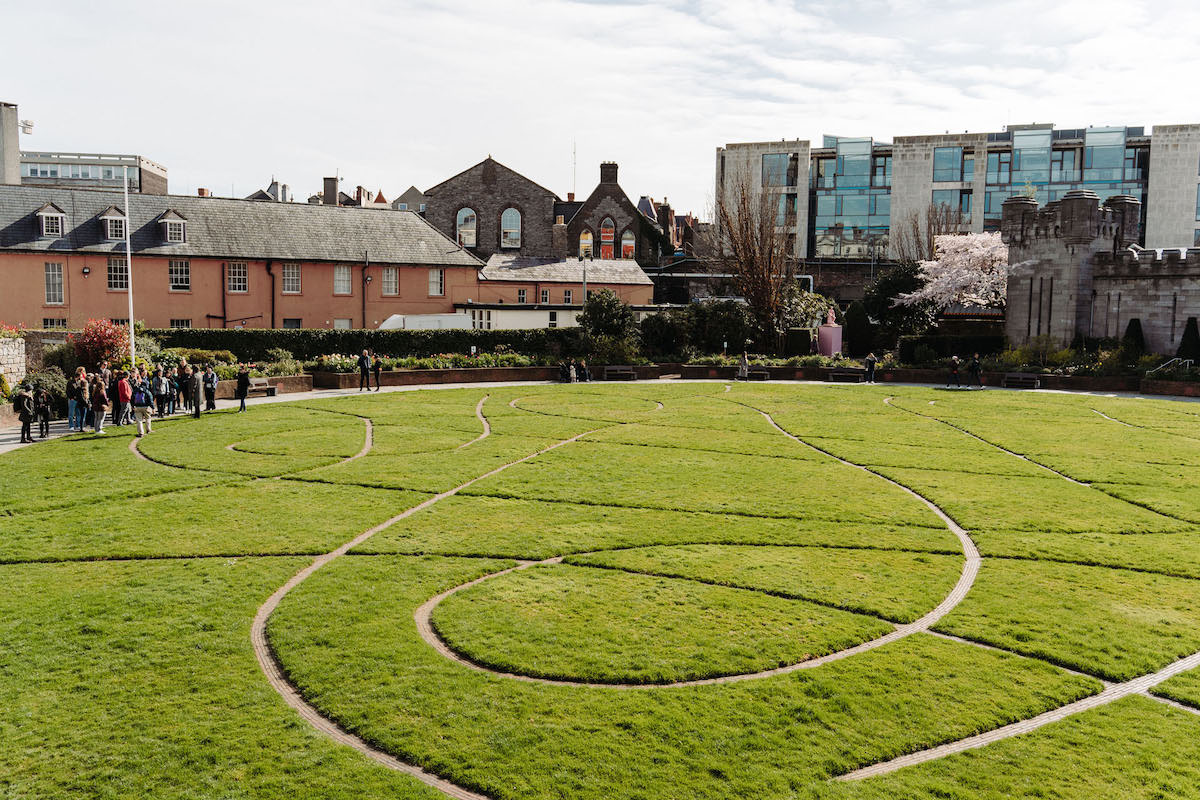 Group of people walking around a park in Dublin