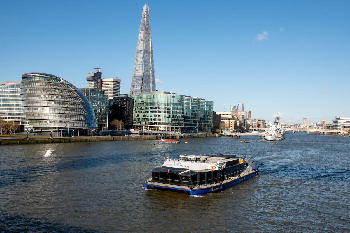 Boat trip on the Thames river with modern buildings in the background