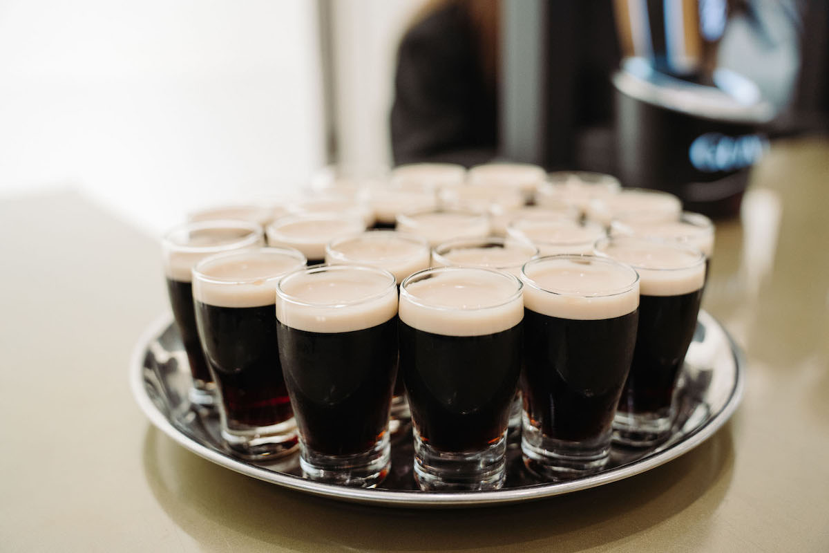 Tray full of Guinness pints