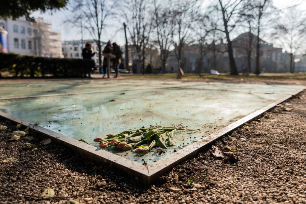 Flowers resting on the Auschwitz Memorial in Amsterdam.