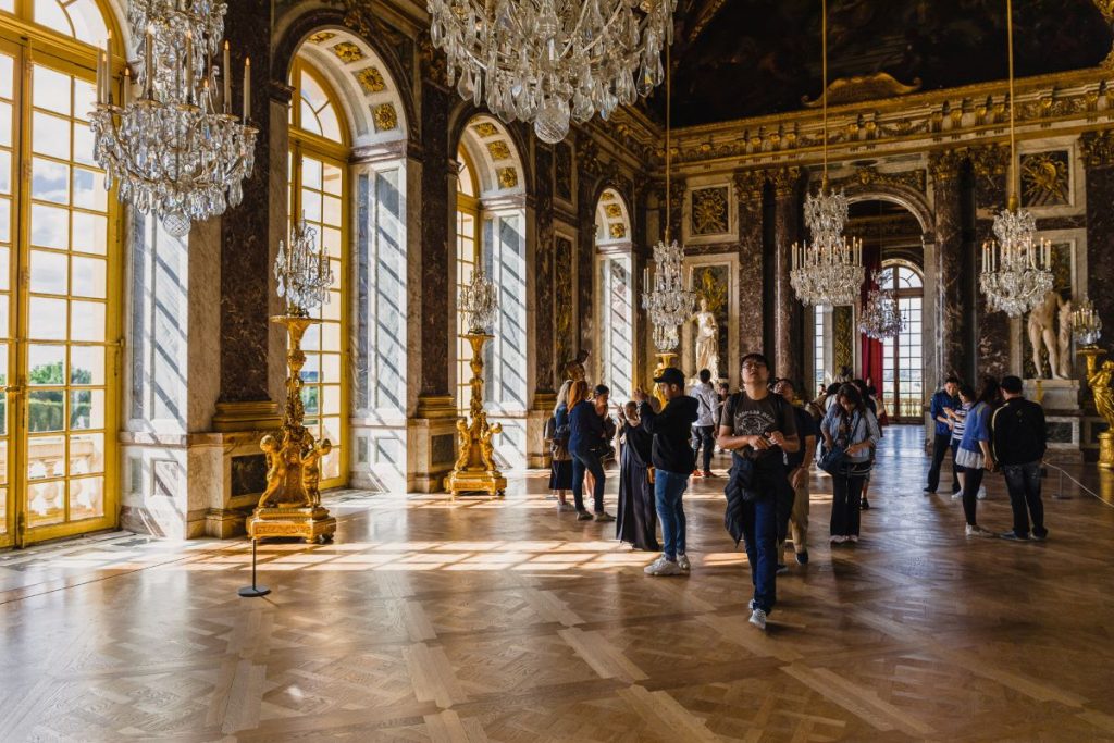 People walking around the Hall of Mirrors.