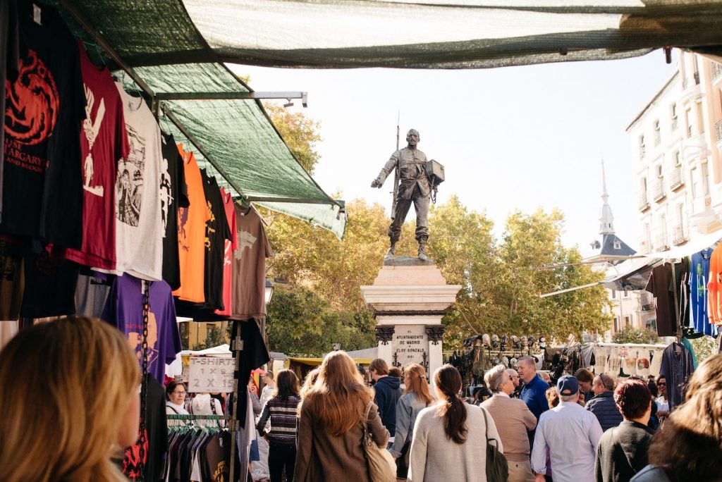 People walking around El Rastro in Madrid. 