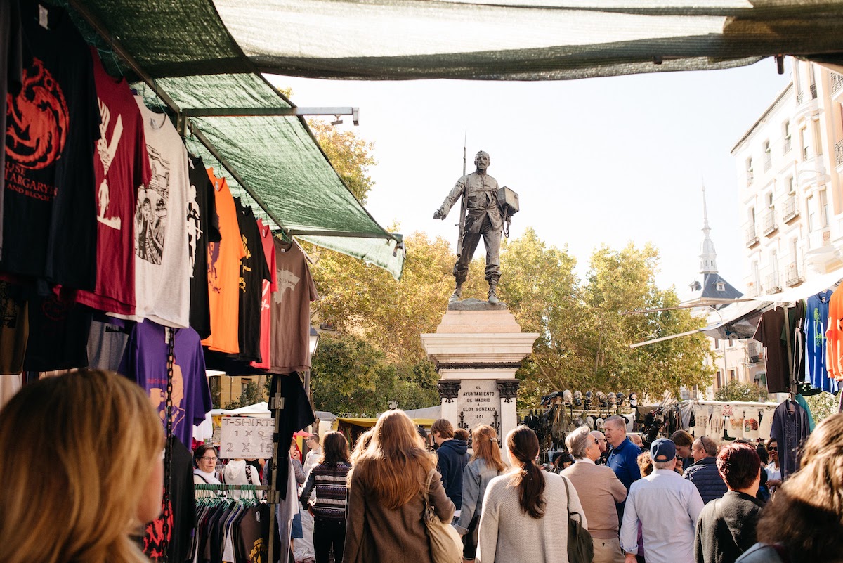 People walking around El Rastro in Madrid. 