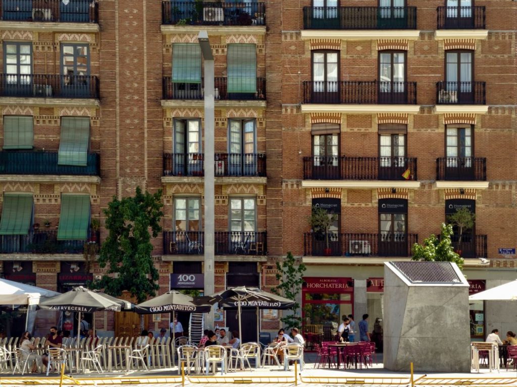 People sitting at an outdoor restaurant in the Salamanca district of Madrid. 