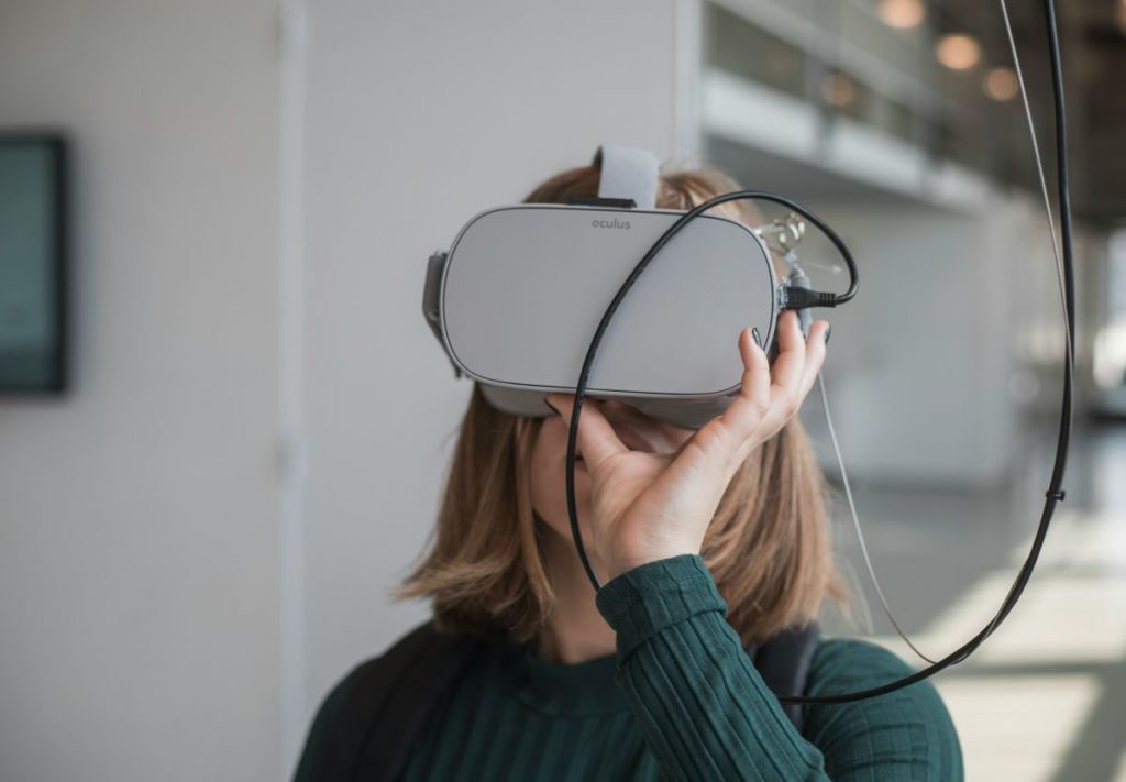 A woman having a VR experience at a museum. 