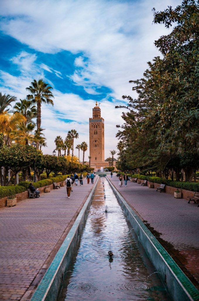 A path with people walking on it leading to Koutoubia. 