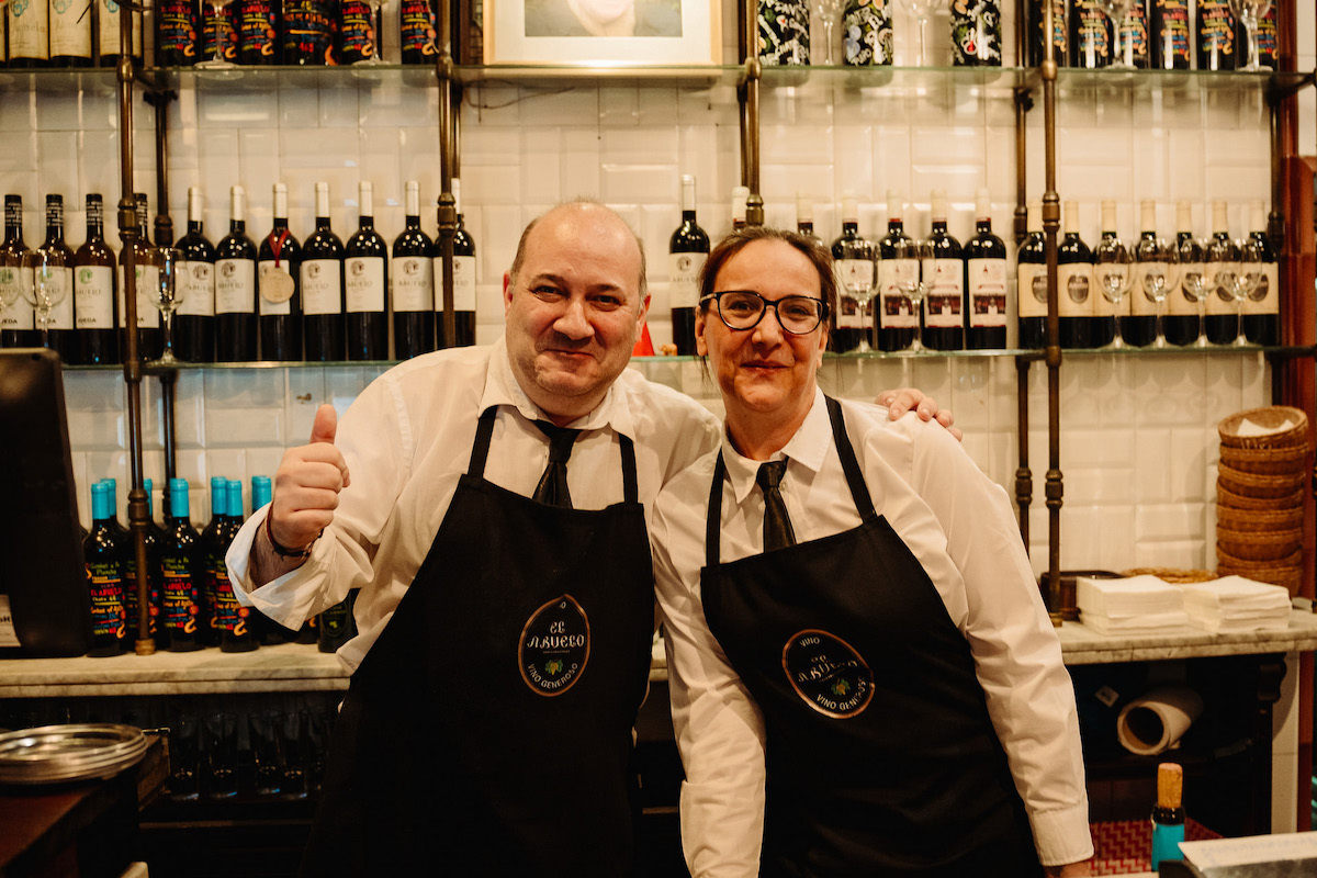 El Abuelo bartenders posing for a photo in a bar in Madrid