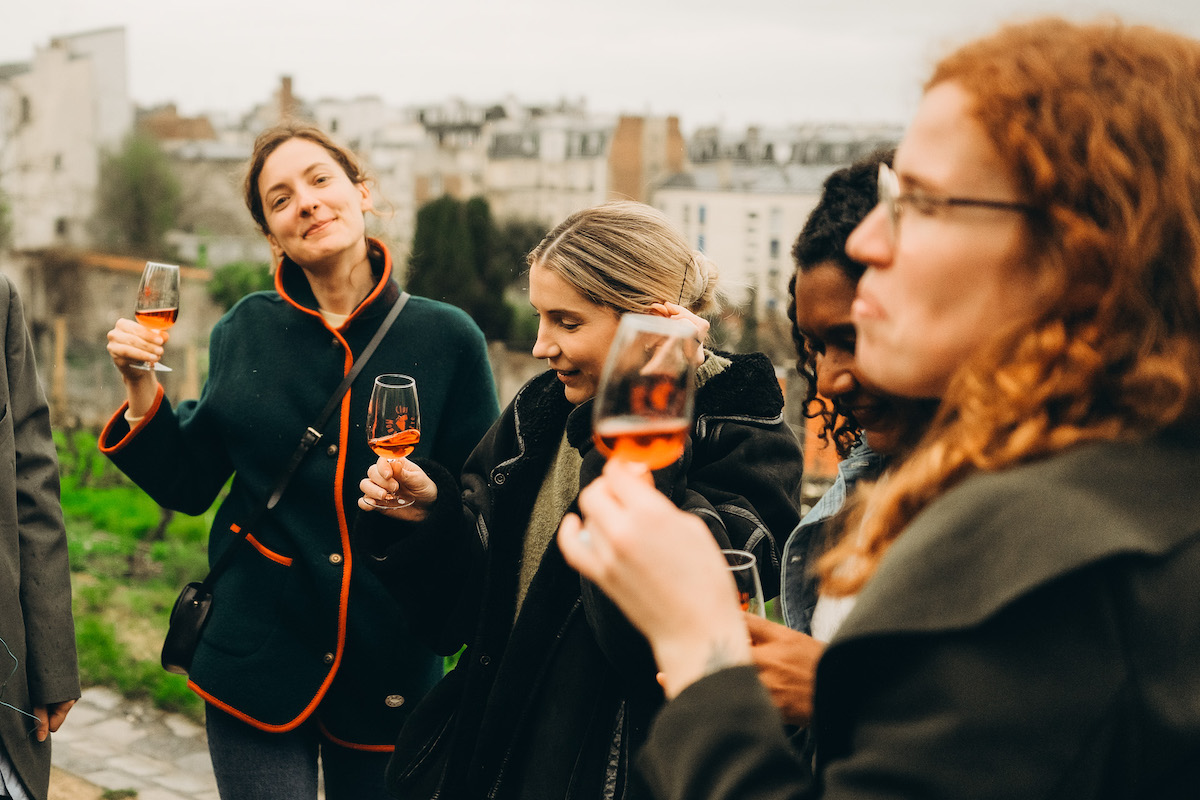 People enjoying a glass of wine outside in Montmartre