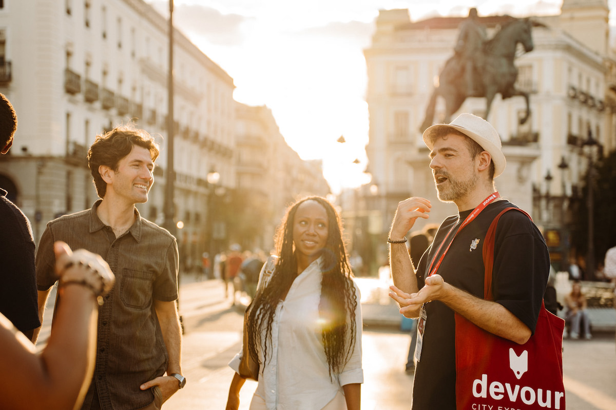 Group in Plaza del Sol, Madrid, sunset