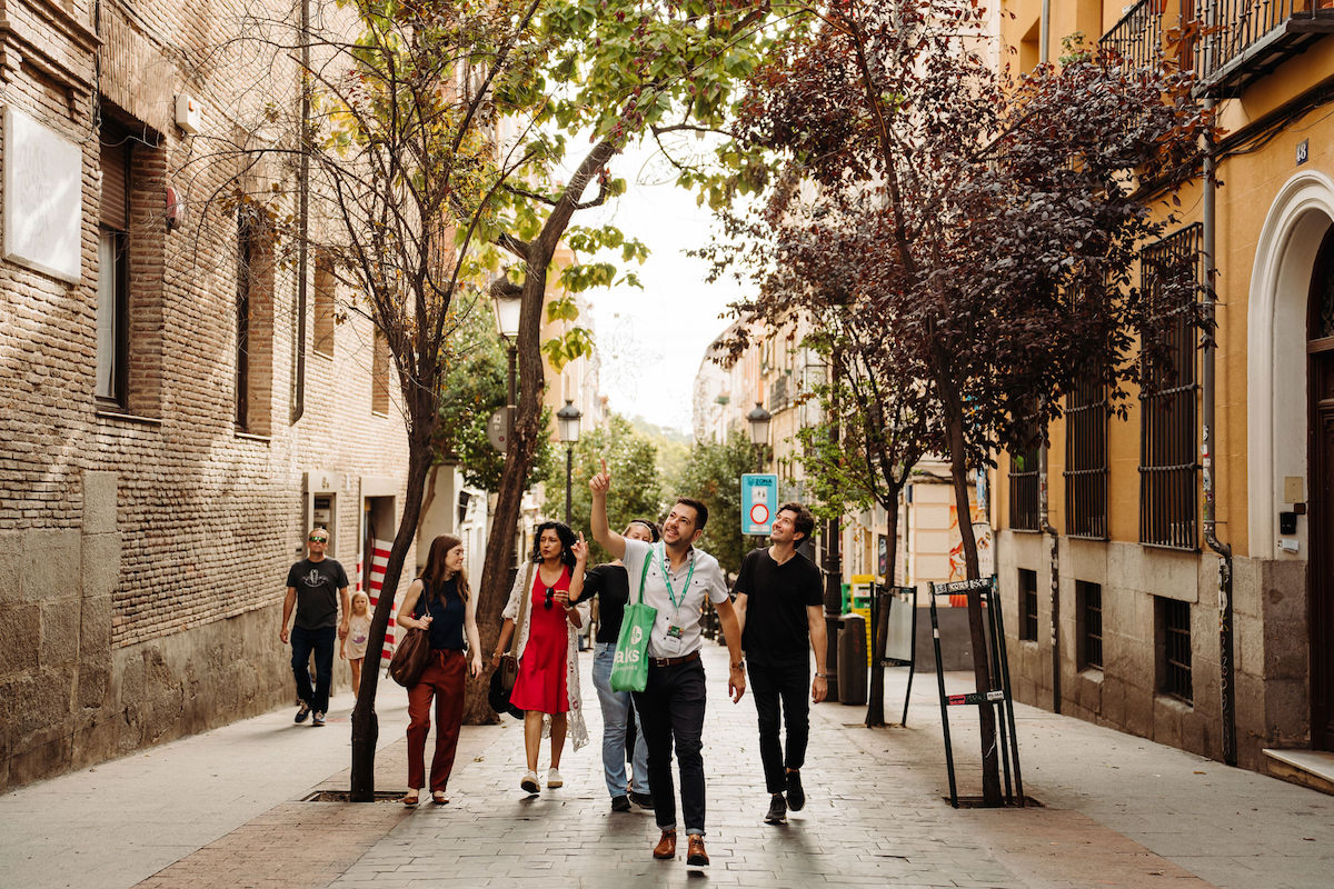 Tour guide walking with group in Madrid