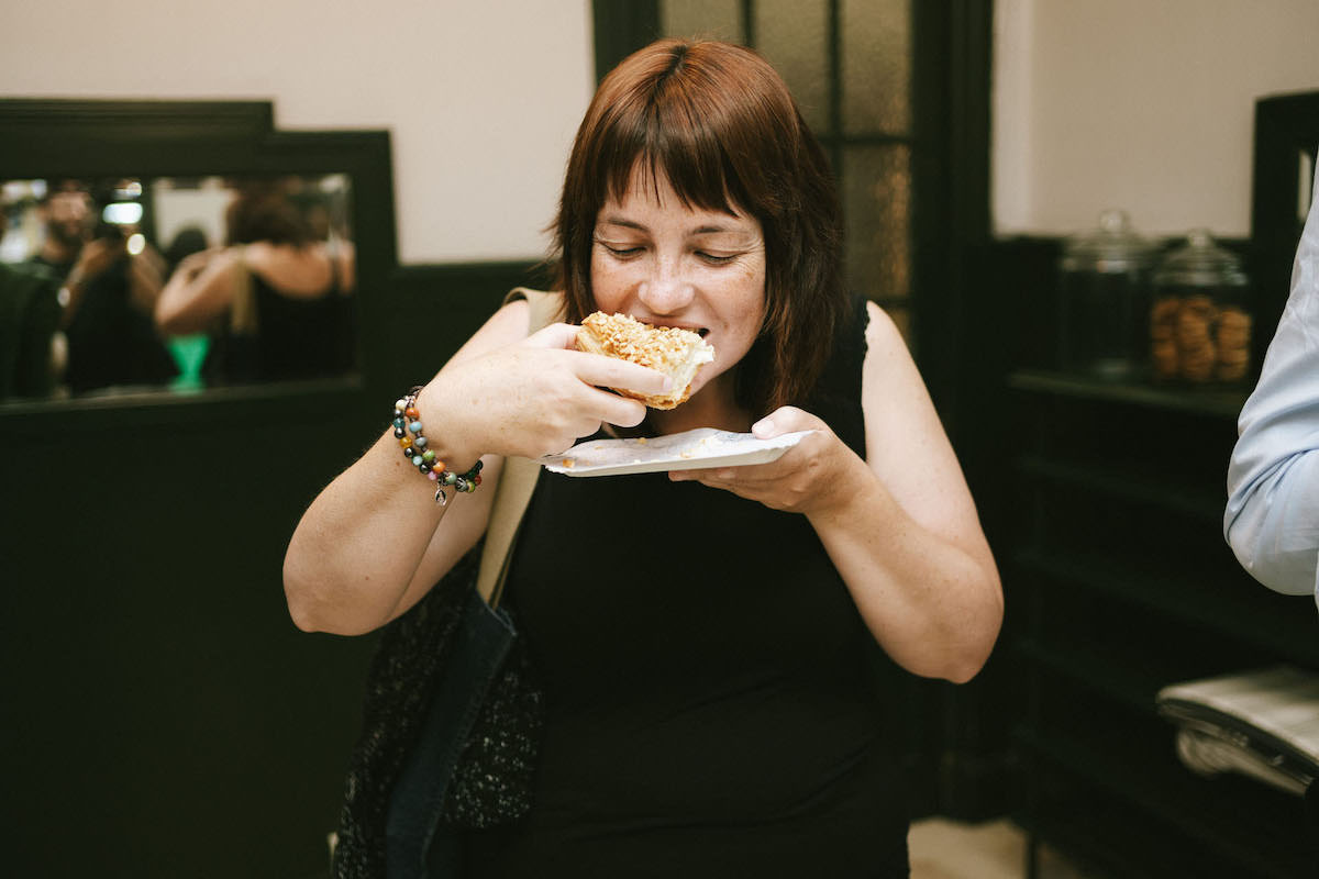 Person eating a cake