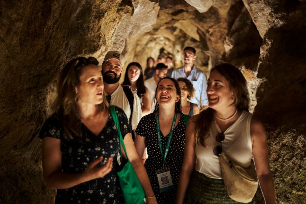 People walking around the tunnels of Quinta da Regaleira.