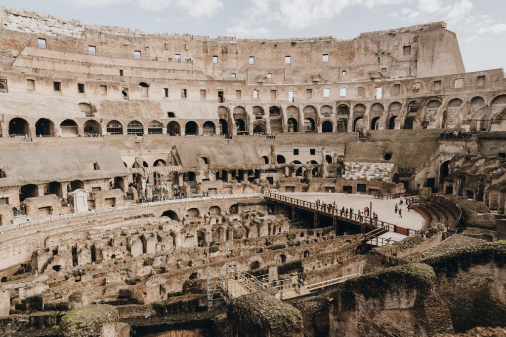 People walking around the Colosseum in Rome. 